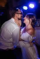 the first dance of the bride and groom inside a restaurant photo