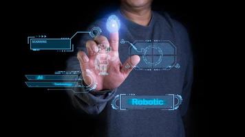 A person is pressing a finger scan to activate the AI system. AI systems can help humans to work faster and better. photo