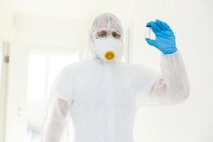 Man scientists wear protective clothing. on a white background photo