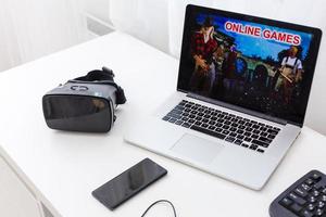 a video game on a laptop is on the table photo