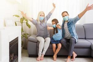 family On The Sofa Watching tv at home. Stay at home during quarantine photo