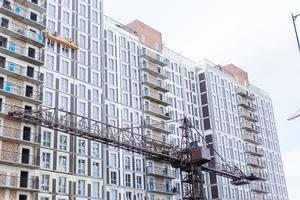 Extensive scaffolding providing platforms for work in progress on a new apartment block UK photo