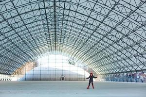 Metal roof interiors structure of modern building. large glass roof hangar photo