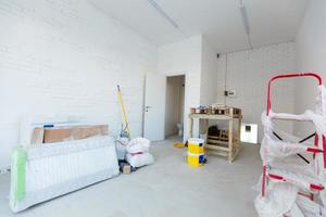 Small apartment without repair in a new building. A room in an unfinished house. Walls of foam block and concrete floor in a tiny apartment. photo