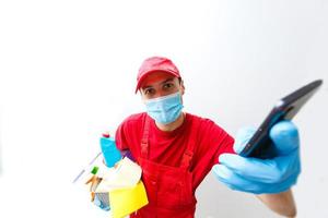 Cleaning and Disinfection at town complex amid the coronavirus epidemic. Professional teams for disinfection efforts. Infection prevention and control of epidemic. Protective gloves and mask photo