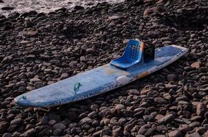 Paddle board on the shore photo