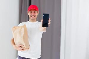 Paper container for takeaway food. Delivery man is carrying photo