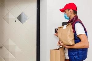 food delivery man Wearing Medical Mask. Corona Virus Concept photo