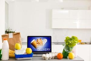 Food Delivery Food Laptop on table. Warm tone photo