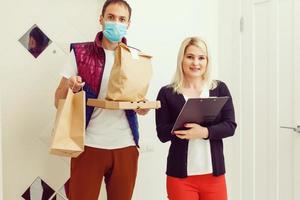 food delivery man Wearing Medical Mask. Corona Virus Concept photo