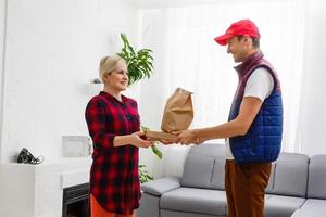 Man food delivery in an apartment photo