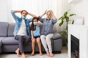 family On The Sofa Watching tv at home. Stay at home during quarantine photo