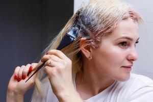 The process of hair coloring,hair coloring,Hair Colouring in process,Woman gets new hair colour,Hair Colouring in process photo