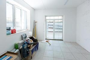 Unfinished apartment interior, repair in a white office room photo