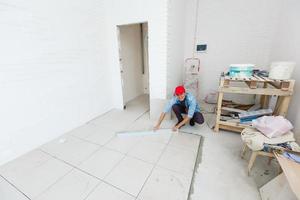 Installing Luxury tiles on the floor photo