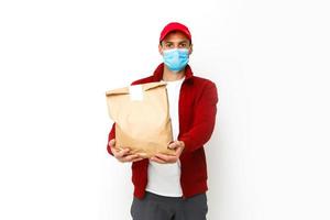 food delivery man Wearing Medical Mask. Corona Virus Concept photo