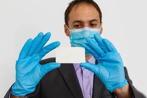 Use protect filters against coronavirus Businessman in hygienic mask and gloves, 2019-nCoV, flu epidemic. isolated photo