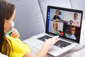 Coronavirus home school concept, quarantine. Girl doing homework. Modern lifestyle photo