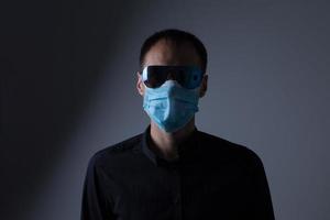 Strong man wearing mask to prevent flu virus and dust air pollution on white background photo