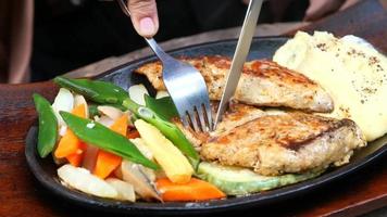 Grill fish fillet with fresh salad on plate close up video