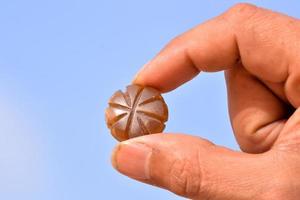 Holding small gemstone photo