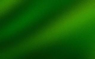 Attractive green gradient background with noise or grain textures. Green grunge texture background. Blurred gradient background. Sprayed gradient with the grain or noise effects. photo