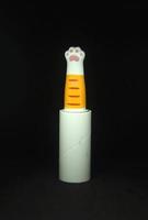 Unique shaped lint roller for house bed, fur on clothes, or rug glue. Orange ginger cat pink paw roller. photo