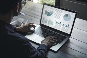Web analytics and digital marketing. Top view of business man using laptop photo