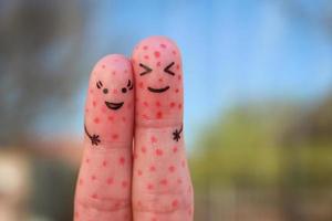 Fingers art of couple with problem skin. photo