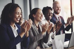 Cropped shot of an unrecognizable diverse group of businesspeople applauding while sitting photo