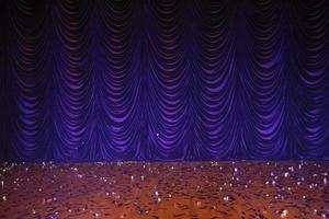 Theatrical background. Purple stage curtains and floor. photo