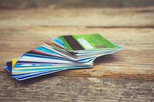 Credit card on wooden background. Toned image. photo