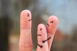 Finger art of family during quarrel. Concept of divorced parents. Idea mother does not gives the child to communicate with his father. photo