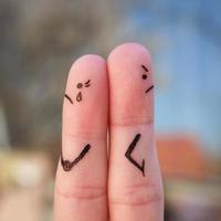 Fingers art of couple. Couple after an argument looking in different directions. photo