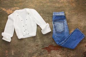Children's clothing, jacket, shirt, jeans. Top view. photo