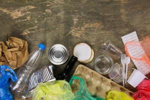 Closeup of waste on old wooden background. Top view. photo