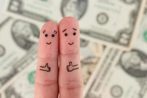 Fingers art of a Happy couple. Man and woman show sign of class on background of money. photo