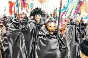 Unidentified people wearing carnival masks at the Venice Carnival in Venice, Italy, circa February 2022 photo