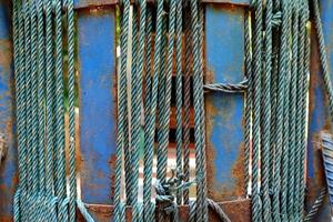 Close up Rope ties around the Rusty Cart. photo