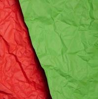 Crumpled red and green paper sheets, paper texture. Background for designers photo