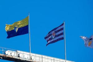 Flags of different countries and sports teams, flags with different coloured stripes. photo