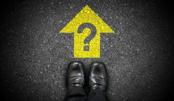 Black Business Shoes, Yellow Forward Arrow and and Question Mark - Problem Concept photo