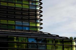 modern office building with coloured glass and palm trees photo