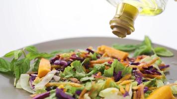 Healthy lifestyle. Pouring olive oil on the salad. Pouring olive oil on the salad. Eating healthy. video