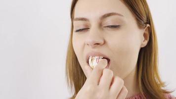 Close-up portrait of woman eating chocolate balls. Eating chocolate. Close-up portrait of woman eating chocolate. video