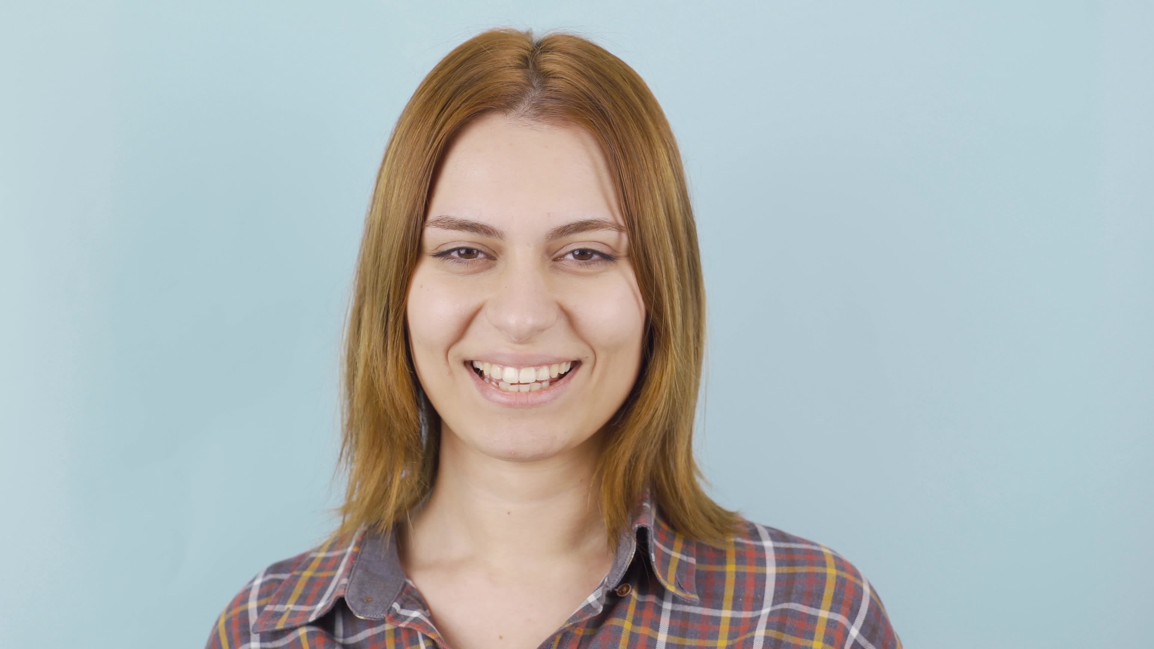 Woman winking at camera. Blink. Young woman winks at camera. 21568039