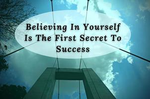 Motivational quote - Believing in yourself is the first secret to success. Blue sky and bridge background. photo