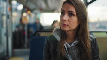 Public transport. Woman using smartphone. video