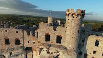 Aerial view on Castle in Ogrodzieniec at sunset, Poland. Filmed on FPV drone