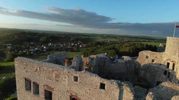 Aerial view on Castle in Ogrodzieniec at sunset, Poland. Filmed on FPV drone video